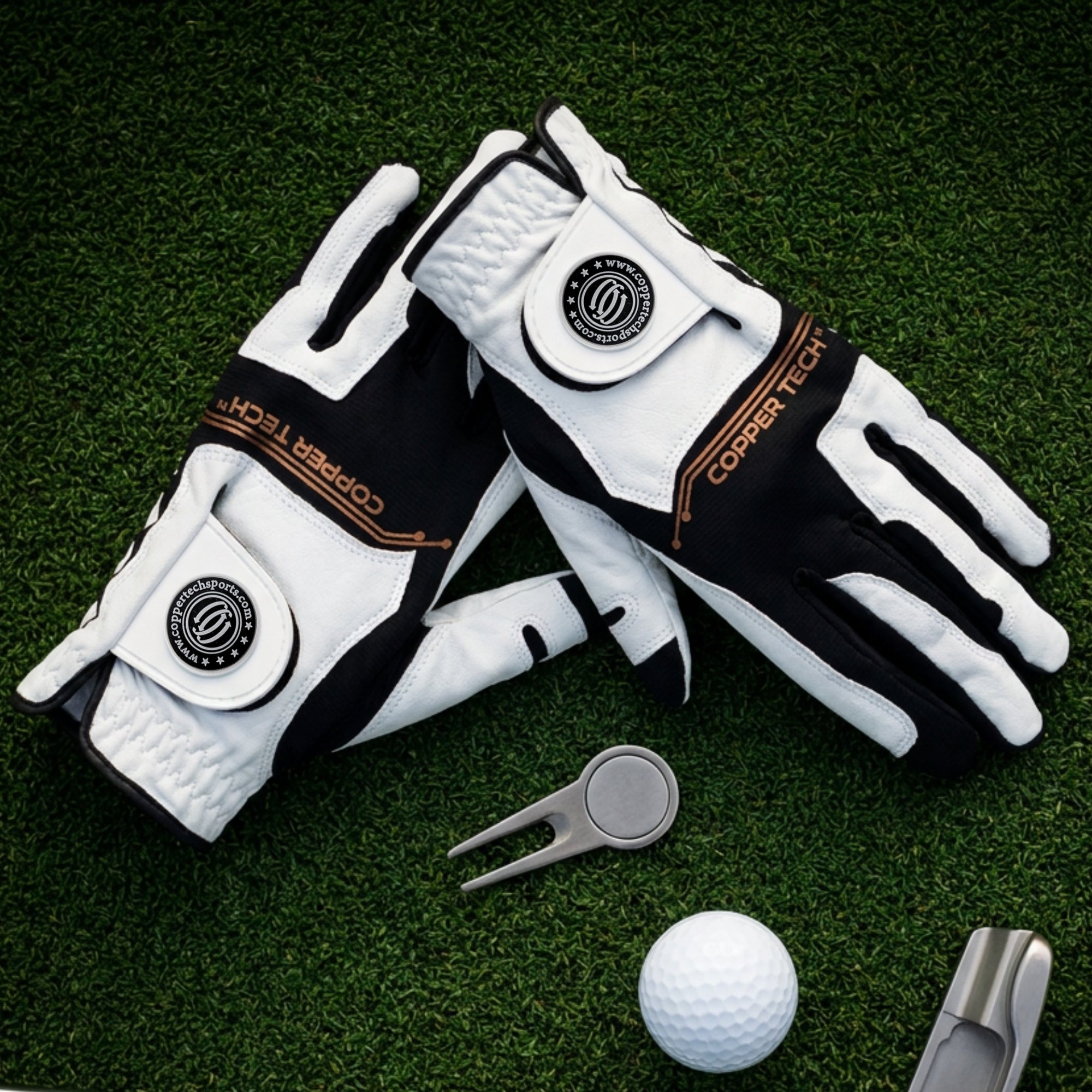 White and black Copper Tech golf gloves on grass